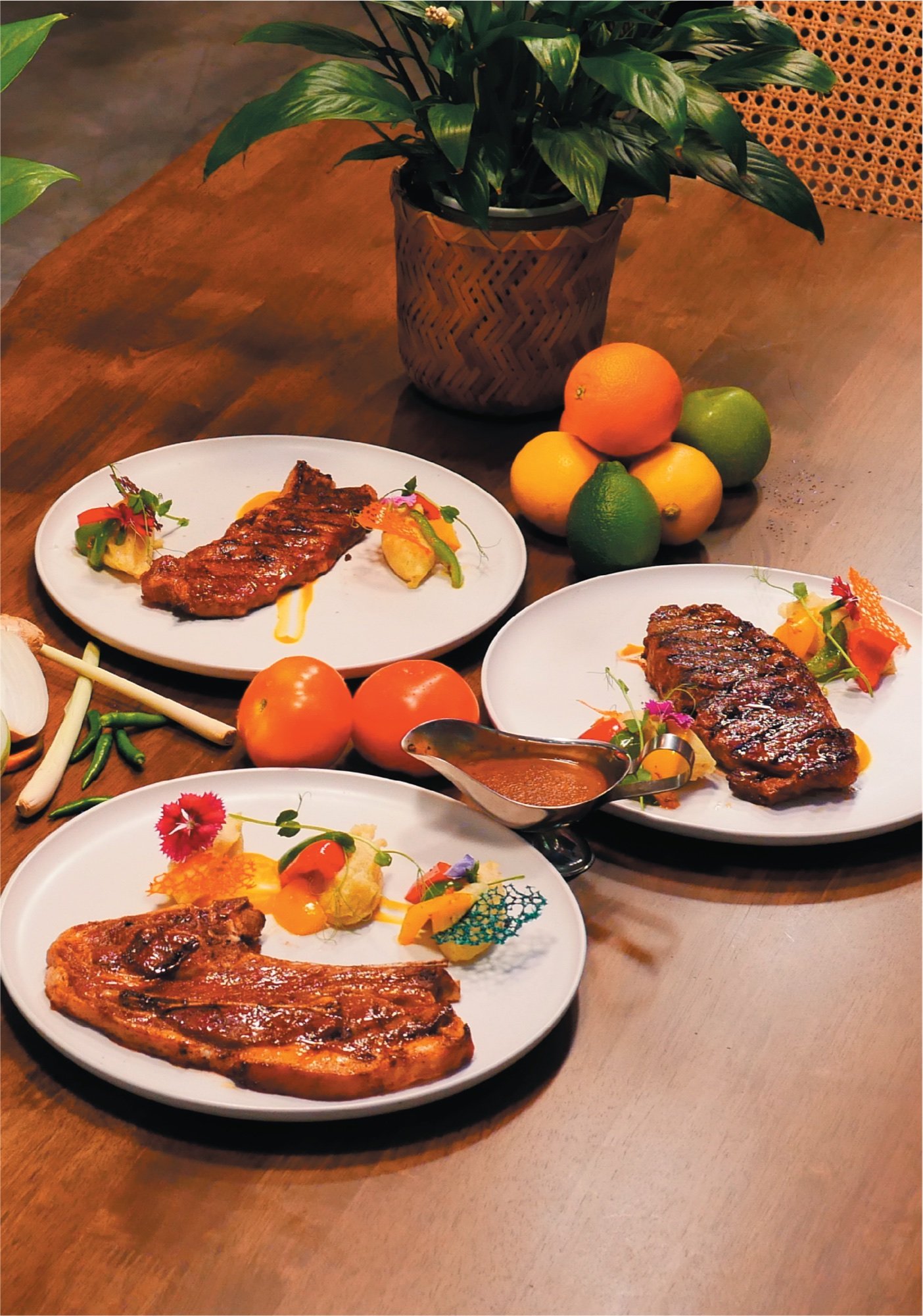 A collection of Lambogrill steak dishes arranged on a warm wooden table